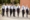 Group Of Teenage Students In Uniform Outside School Buildings